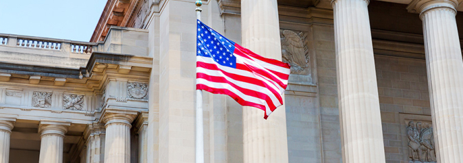 USA Flag waving at courthouse