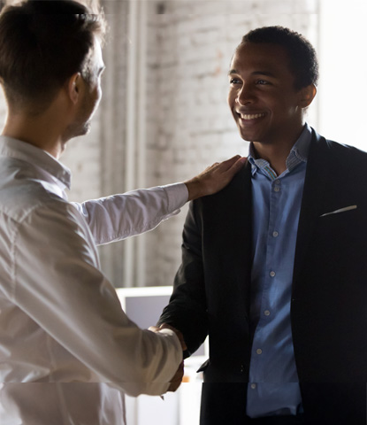 caucasian boss handshake black employee greeting with success