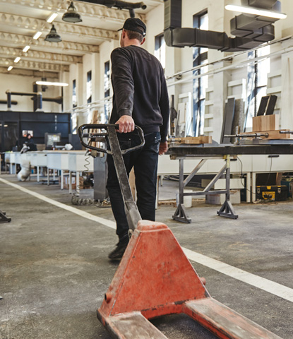 caucasian worker with pallet jack