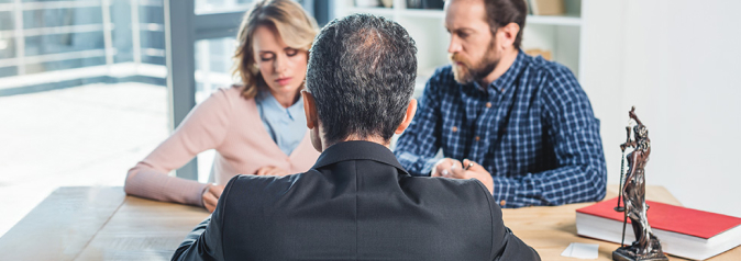 couple having meeting with lawyer in office